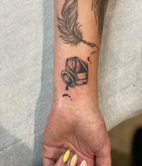 a person holding a tattoo