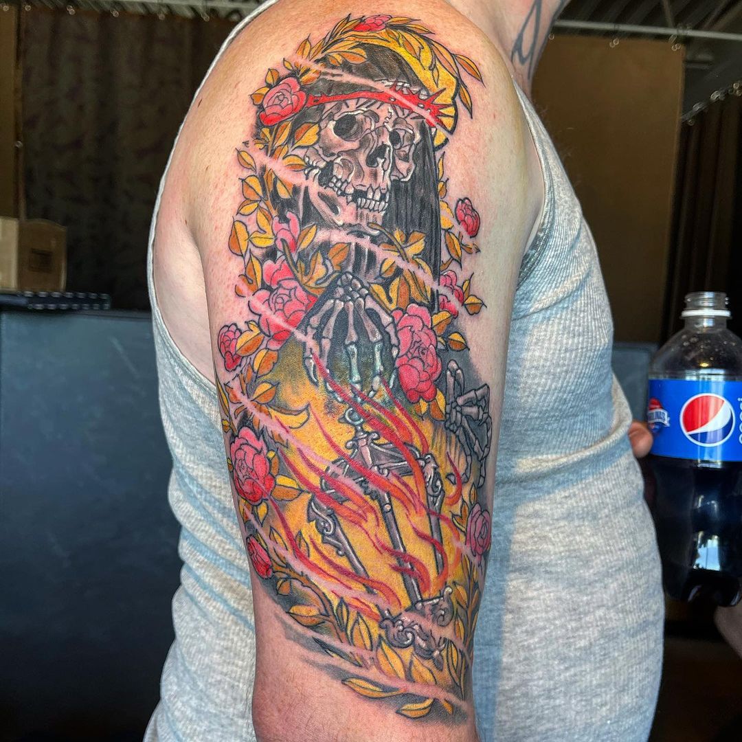 a person holding a tattoo on his head