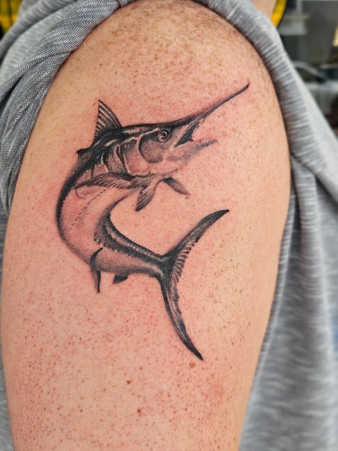Walk-in tattoo shop Key West FL client receiving fresh ink at Southernmost Tattoo