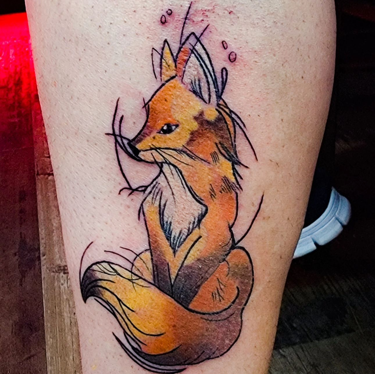 a tattoo on his arm
