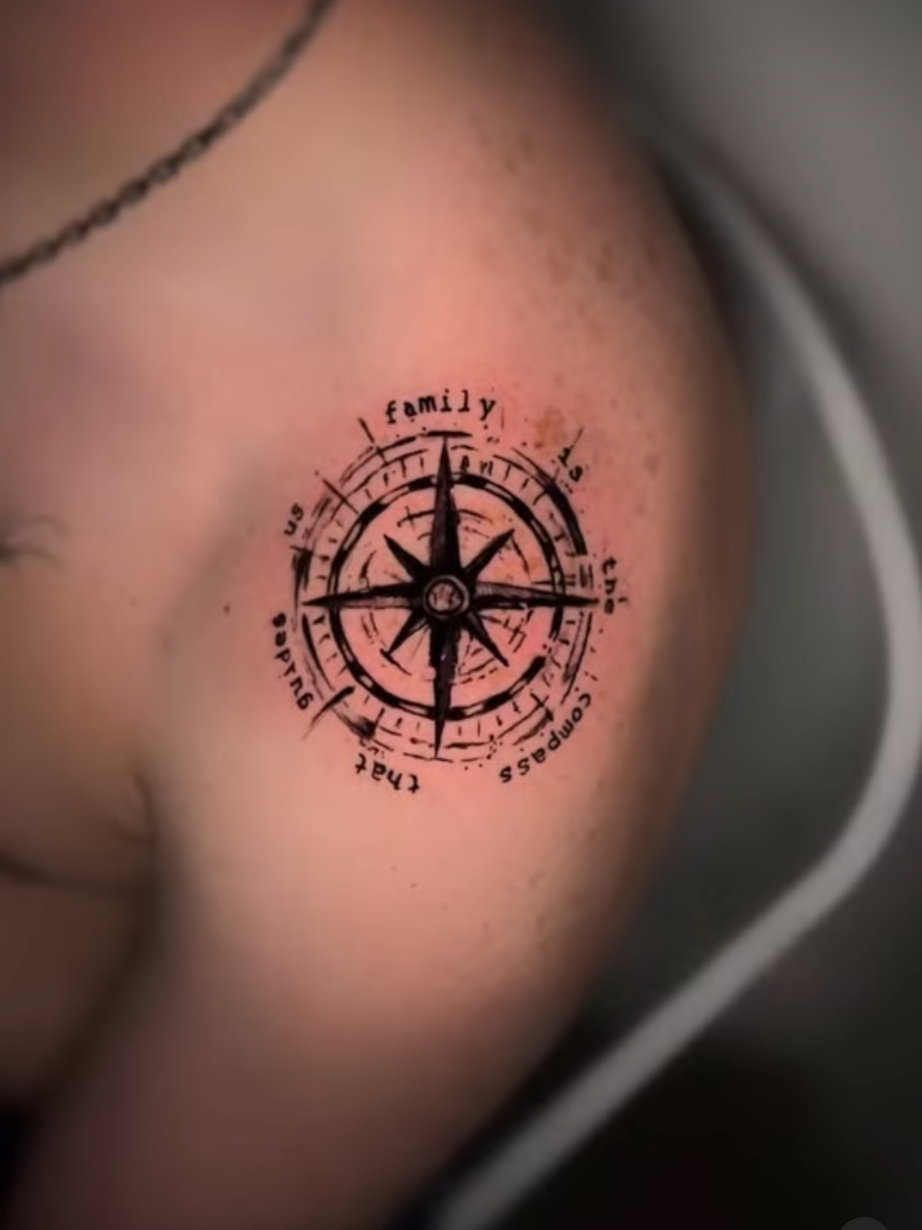 a person holding a tattoo