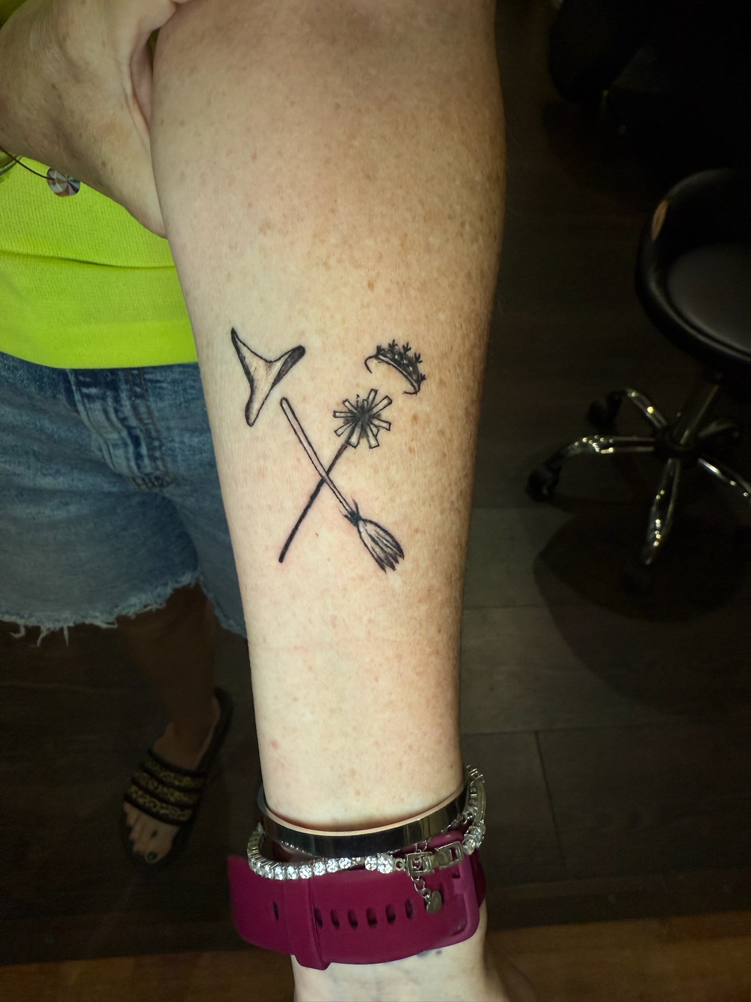 a person holding a tattoo on his head