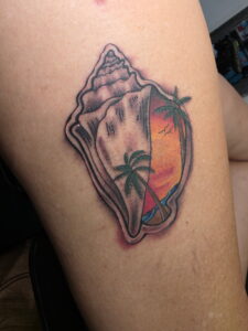 A Close Up Of A Tattoo On His Head