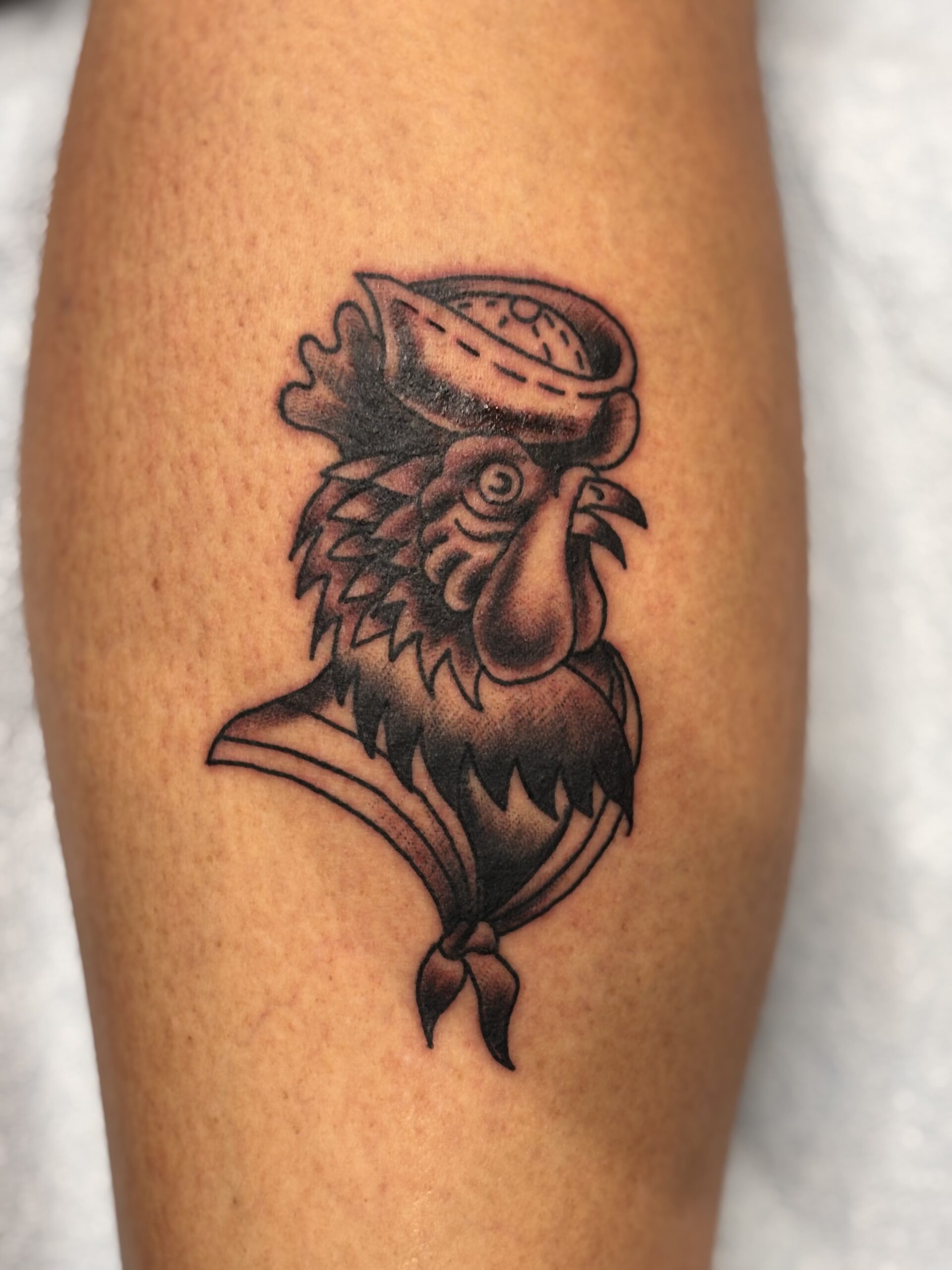 Fancy sailor rooster tattoo